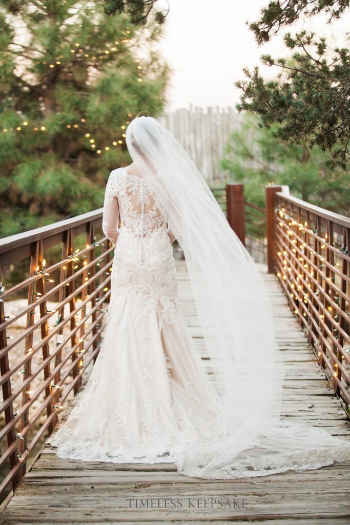 Bride posing on bridge